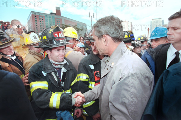 U.S. President George W. Bush greeting firefighters, police and rescue personnel at World Trade Center disaster site, Financial District, Manhattan, New York City, New York, USA, Paul Morse, George W. Bush White House Photo Office, September 14, 2001