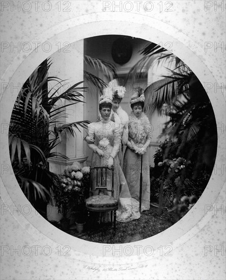 At the wedding of Princess Louise of France, Queen Alexandra of England, her daughter, Princess Victoria, and, between them, Princess Helen of Orléans