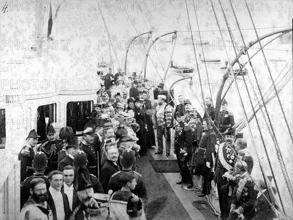 Aboard a royal yacht, Edward VII of England in Danish uniform, with Queen Alexandra and, between them, the Dowager Empress Maria of Russia