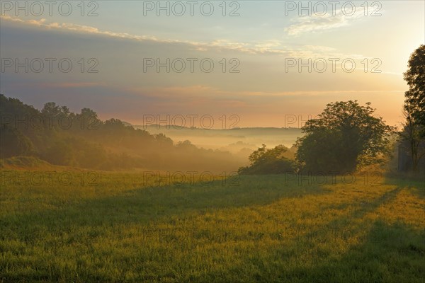 Country landscape with morning mist in Corrèze