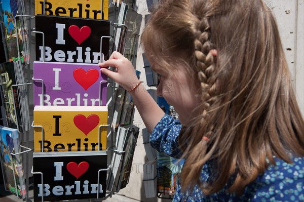 Germany, Berlin, child choosing postcards