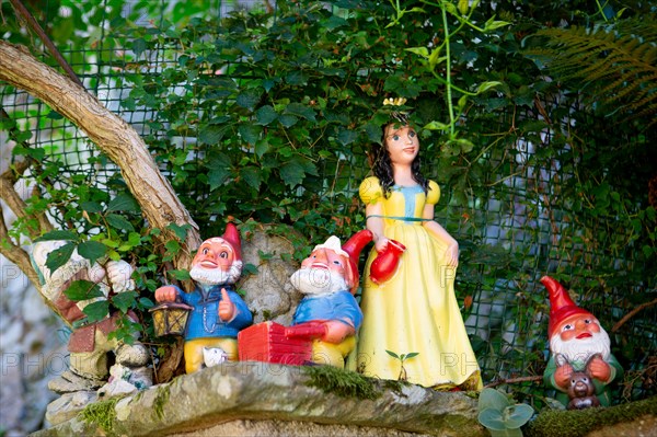 Snow White and dwarfs in a garden