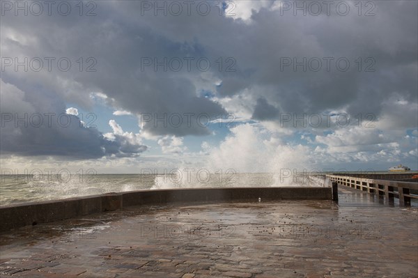 Wave flooding the dyke