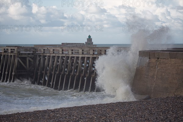 Wave flooding the dyke