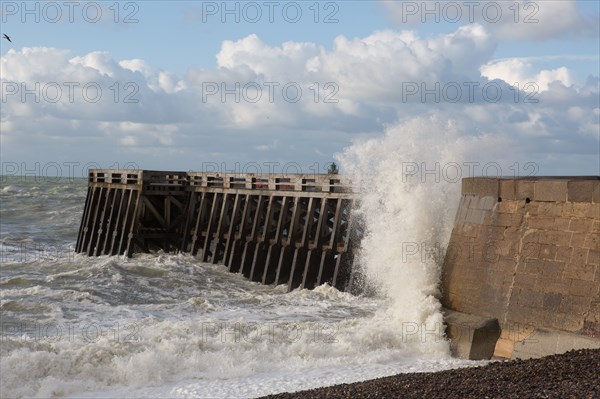 Wave flooding the dyke