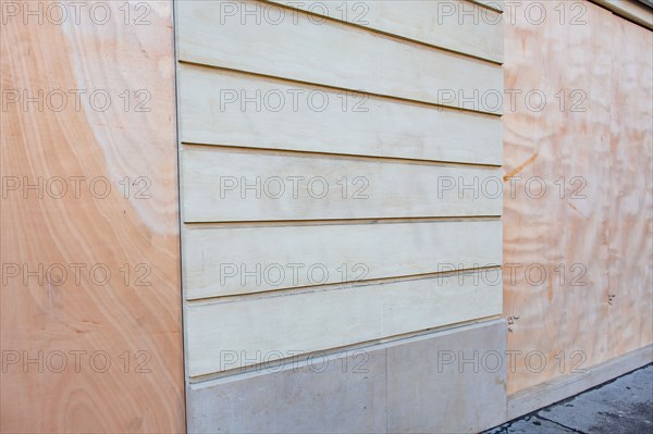 Paris, windows of a bank protected with sealed wood panels