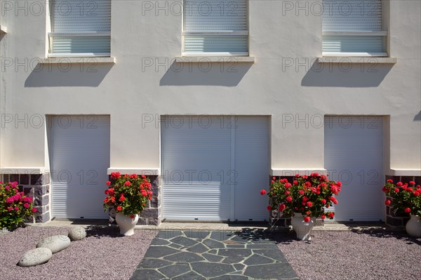 Pleneuf Val André, house with closed shutters and geranium pots