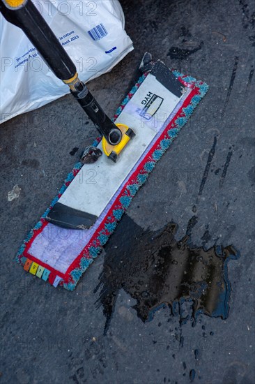 Paris, broom and puddle