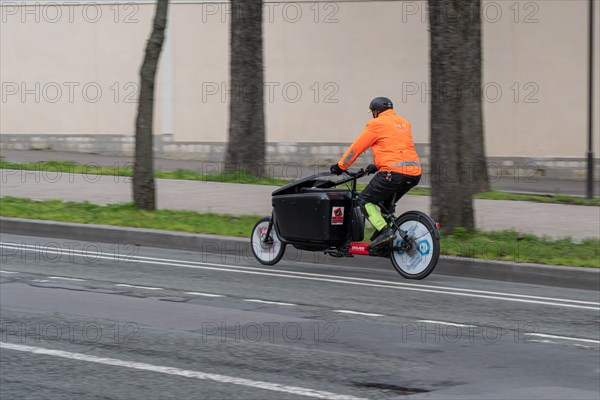 Paris, delivery man on a bicycle