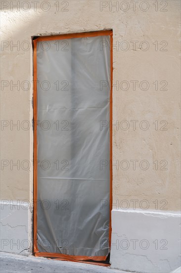 Paris, door with a tarp on it