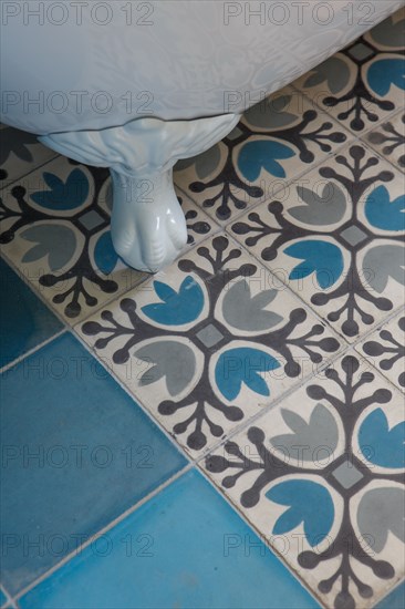 Cement tiles and old-fashioned bathtub base