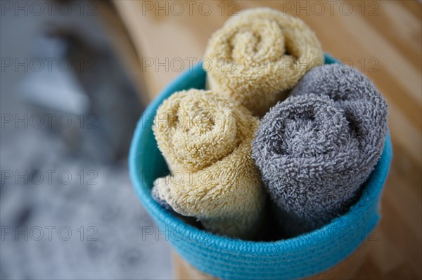 Guest towels presented in a blue basket