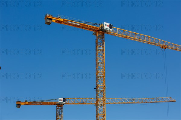 Construction cranes in the J. Chirac park in Rueil Malmaison