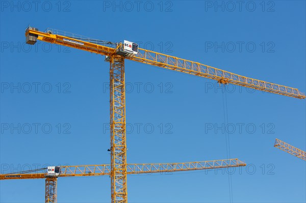 Construction cranes in the J. Chirac park in Rueil Malmaison