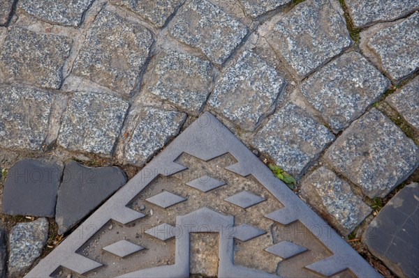 Paving stones and manhole covers