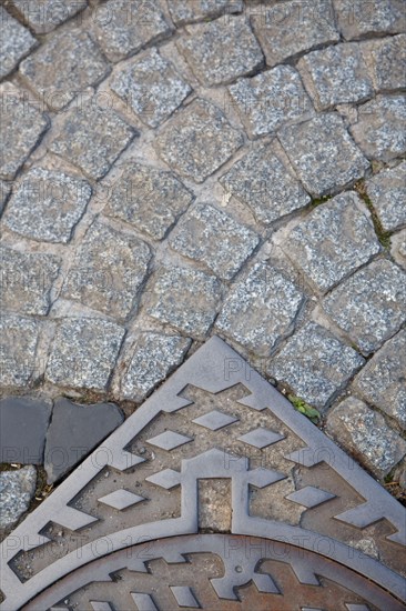 Paving stones and manhole covers