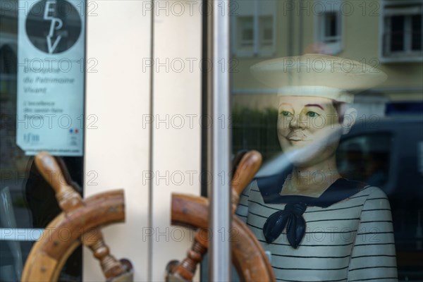 Trouville, glass door of a shop