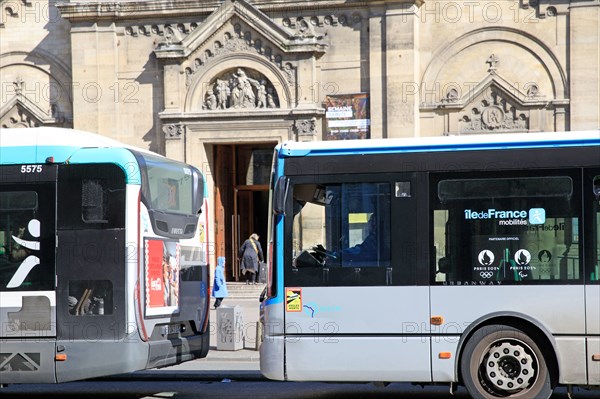 Paris, two buses in front of Notre-Dame des Champs church