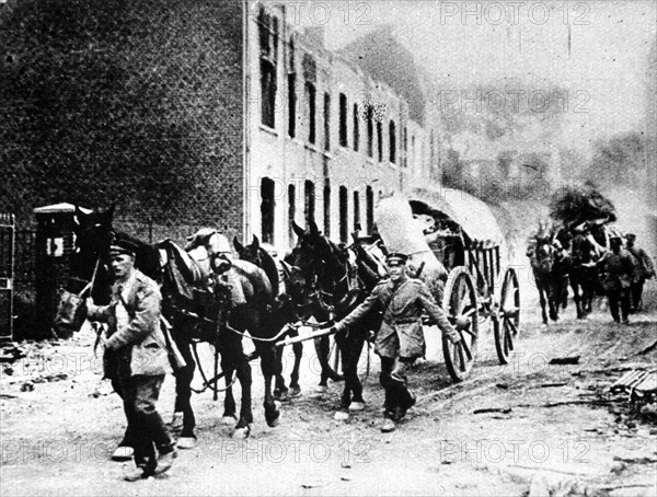 Food raid by German soldiers in an abandoned French village.