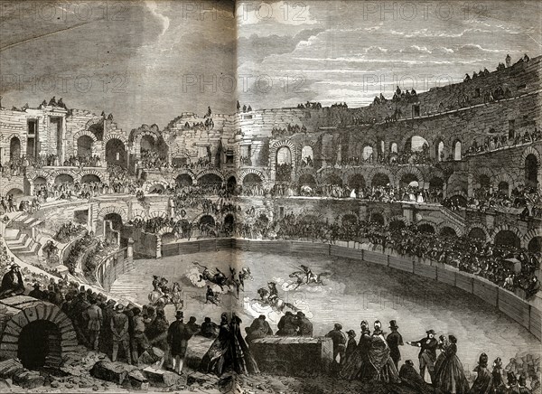 A bull fight in the Nîmes bullring.