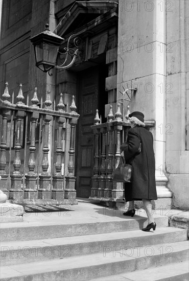 Woman entering the church of St Martin in the Fields, London, c1950