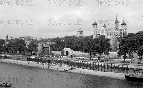 People relaxing on Tower Beach, London, c1945-c1955