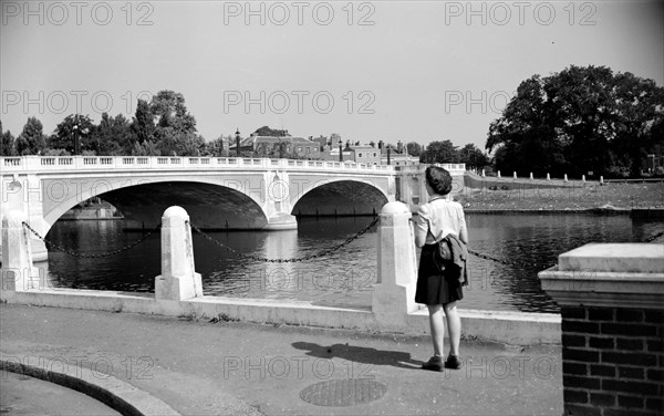 Woman admiring Hampton Court Bridge, London, c1945-c1965