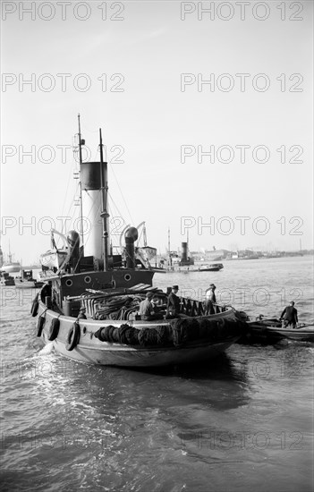 A tug leaving the Royal Terrace Pier at Gravesend, Kent, c1945-c1965