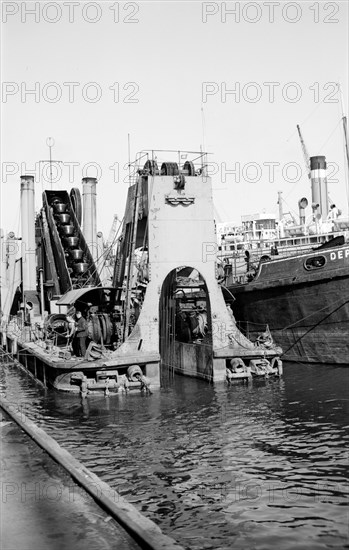 A dredger at work in Tilbury Docks, Essex, c1945-c1965