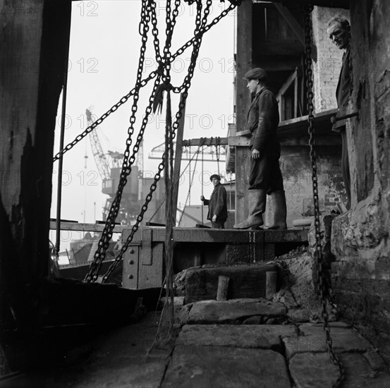 Men working at a wharf on the River Thames in Limehouse, London, c1945-c1965