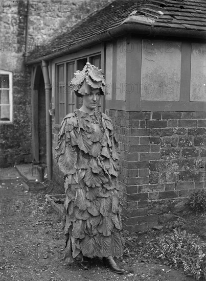 A woman in a cabbage leaf costume, Hellidon, Northamptonshire, c1896-c1920