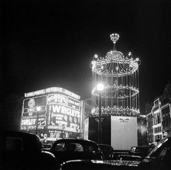 Night scene showing the neon lights of Piccadilly Circus, City of Westminster, c1945-c1965