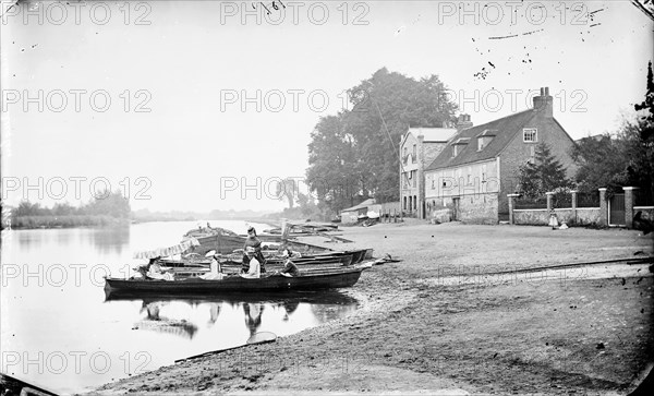 Boats moored on the River Thames near the Anglers Hotel at Walton-on-Thames, Surrey, c1860-c1922