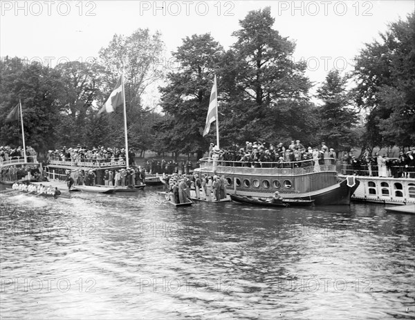 Spectators on the University barges watching a boat race during Eights Week, Oxford, c1860-c1922