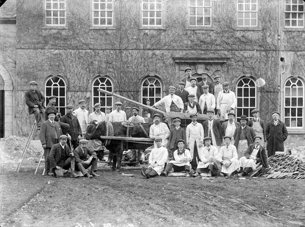 Workmen posing outside a house with a bullock cart, Kingston Lisle, Oxfordshire, c1860-c1922