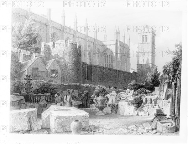 Stonemasons at work in front of the chapel at New College, Oxford, Oxfordshire