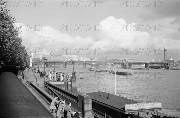 A view of Hungerford Bridge and River Thames, Lambeth, London, c1945-1965