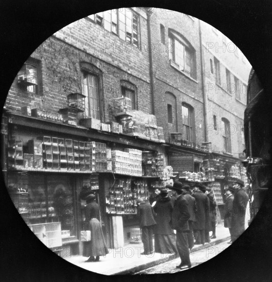 Sunday bird fair, Sclater Street, off Brick Lane, London, c1900. Artist: John Galt