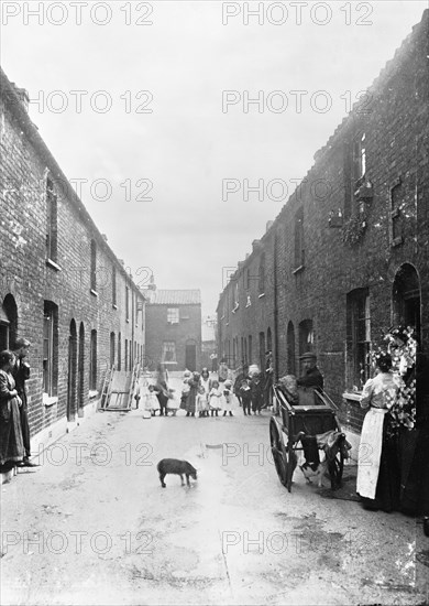 Cat's meat man on a slum street, London, 1900s. Artist: John Galt