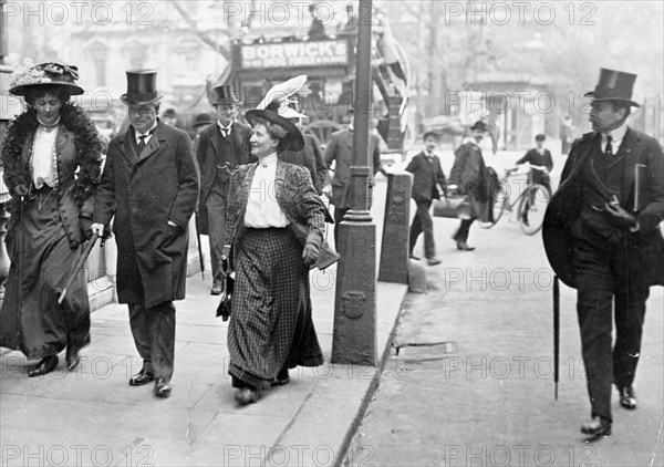 Two suffragettes with Herbert Asquith, c1910. Artist: Unknown