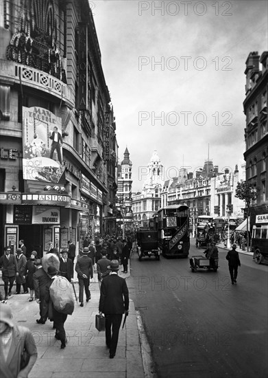 People walking past the Astoria Theatre in Charing Cross Road, Westminster, London, early 1930s. Artist: George Davison Reid