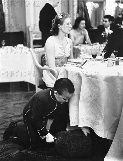 Young boy working at the Trocadero Restaurant, Leicester Square, Westminster, London, 1939. Artist: Unknown