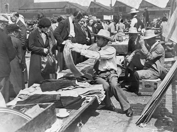 A market stall in Caledonian Market, Islington, London, 1930s. Artist: John H Stone