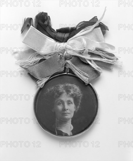 A silver and glass badge with a medallion portrait of Emmeline Pankhurst, c1908. Artist: Unknown