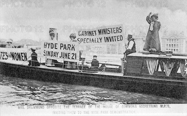 'General' Mrs Drummond in a boat opposite the terrace of the House of Commons, 1908. Artist: Unknown