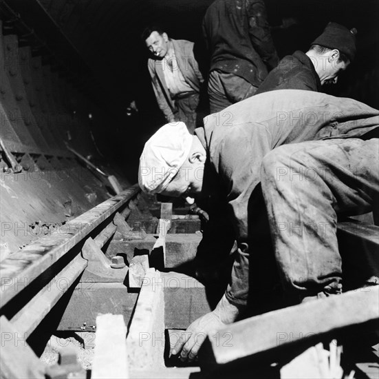 Repairing underground train tracks, London, 1955. Artist: Henry Grant