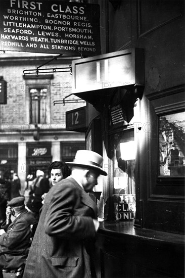 Member of Locomotive Spotters at Victoria Station, 1950. Artist: Henry Grant