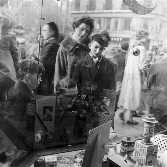 Christmas shoppers outside a toyshop, London, 1957. Artist: Henry Grant