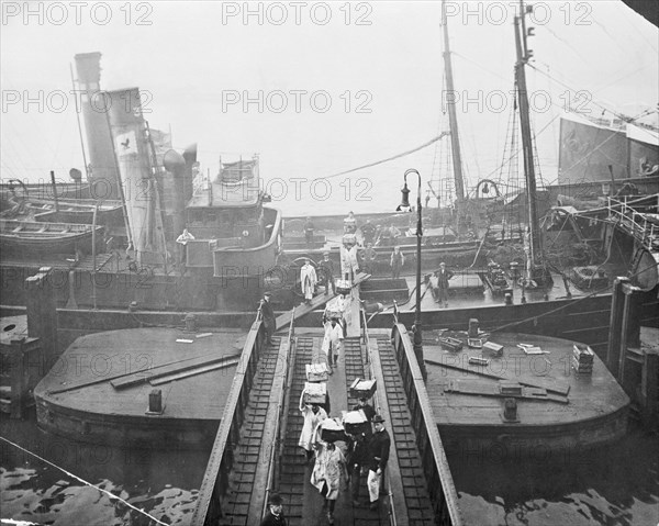 Unloading a fishing boat, Billingsgate market, London, 1923. Artist: Unknown