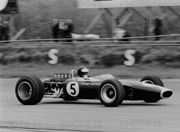 Jim Clark driving the Lotus 49 at the British Grand Prix, Silverstone, 1967. Artist: Unknown